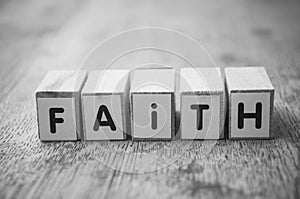 Wooden word on wooden table background concept  - Faith