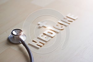 Wooden wording  of medicine and stethoscope on wooden background, Abstract symbol, Medical and healthcare concept