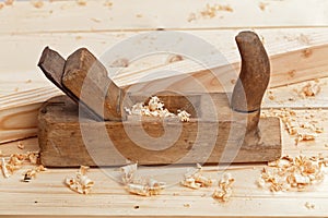 Wooden workbench, plane and shavings