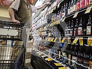Woodinville, WA USA - circa April 2021: View of an older man shopping in the craft beer section at Haggen grocery store