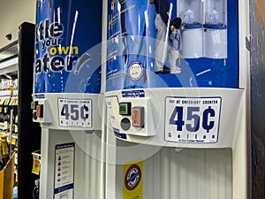 Woodinville, WA USA - circa June 2022: Angled selective focus on a water gallon refill station inside a Haggen grocery store