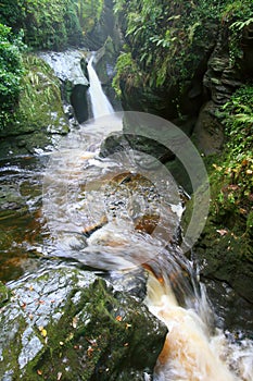 Woodland waterfall and mountain stream