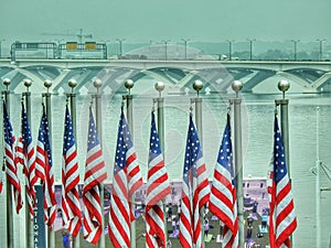 Woodrow Wilson Bridge And United States Flags Over The Potomac River