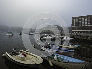 Woods Hole Marina Seascape in a Foggy Summer Morning. Moored Boats and Yachts.