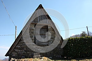 Woodshed in the mountains or storage room built in logs to store things