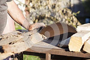 Woodsman working on saw