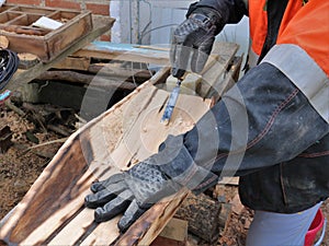 Woodwork with a chisel in a workshop