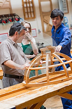 Woodwork class talking about a structure