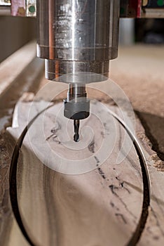 Woodwork cnc machine working on wood board. Tool at the wood factory