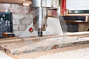 Woodwork cnc machine working on wood board. Tool at the wood factory