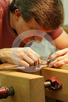 Woodworker Making Close Measurement photo