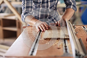 Woodworker making precision cuts with a table saw