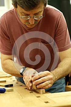 Woodworker Using a Plane
