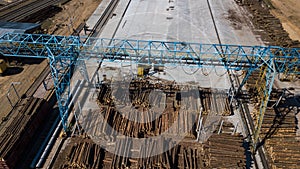 Woodworking industry. Crane loads logs aerial photography with drone