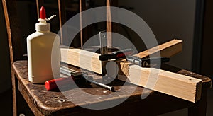 Woodworking Tools and Glue Bottle on Rustic Workbench in Workshop