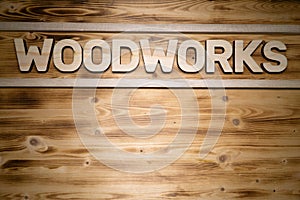 WOODWORKS word made of wooden letters on wooden board photo