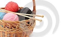 Wool balls in a basket isolated on a white background. Free space for text. Wide photo