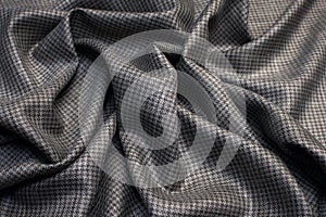 Wool fabric with silk, suiting with goose foot pattern. Color is gray-brown. Texture, background, pattern