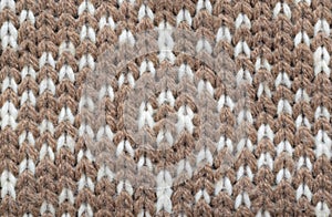 Knitted geometric background closed up photo