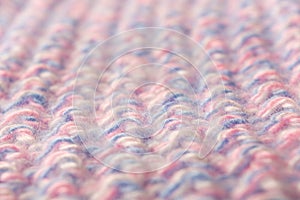 Wool textured pattern background with pink and blue threads. Soft focus