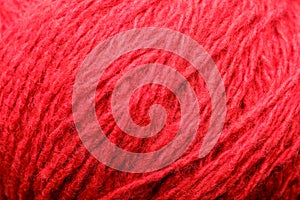 Wool yarn close-up colorful red thread for needlework in macro