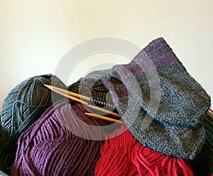 Wool yarn and needles in a basket - knitting hobby club concept