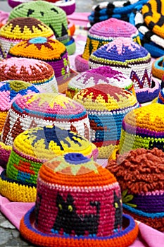 Woolen hats at the market of Otavalo photo