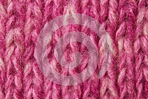 Woolen texture background, knitted wool fabric, pink hairy fluff