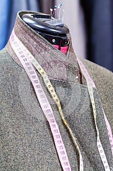 Woolen tweed jacket on dummy and ready suits