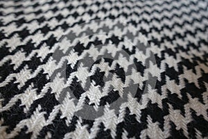 Woollen fabric with crow`s feet pattern in black and white