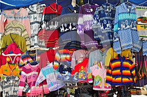 Woollen jumpers on market stall