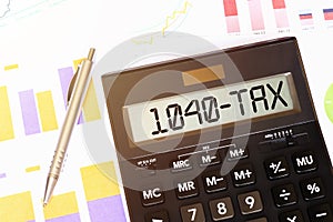 Word 1040 Tax on calculator. Business and tax concept
