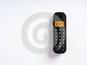 The word 24/7 written on the screen of a wireless phone. Call center assistance, service support, customer care concept