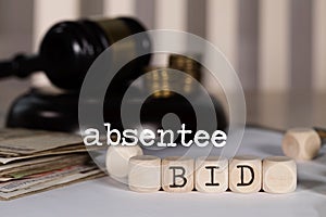Word ABSENTEE BID composed of wooden dices