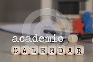 Word ACADEMIC CALENDAR composed of wooden dices photo