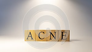 The word acne was created from wooden cubes, kinship and people.