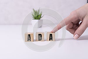 Word ADA Americans with Disabilities Act is made of wooden blocks