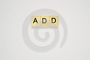 Word add. Top view of wooden blocks with letters on white surface