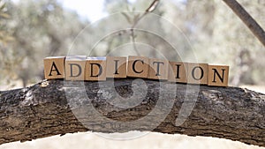 The word ADDICTION was created from wooden cubes.