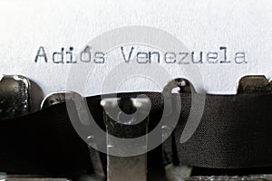 Word `Adios Venezuela` goodbye Venezuela typed on typewriter