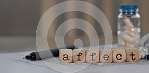 Word AFFECT composed of wooden dices photo