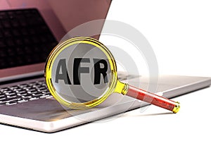 Word AFR on magnifier on laptop , business concept photo