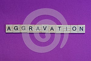 Word aggravation from small gray wooden letters