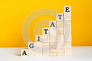 The word agitate is written on a wooden cubes, concept photo