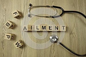 Word ailment from wooden blocks with stethoscope