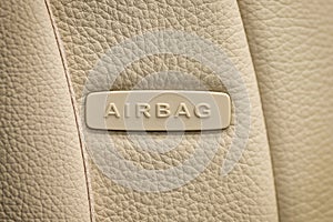 Word Airbag written on car`s leather seat.