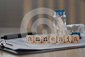 Word AMNESIA composed of wooden dices photo