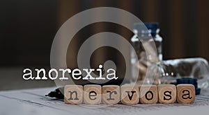 Word ANOREXIA NERVOSA composed of wooden dices photo