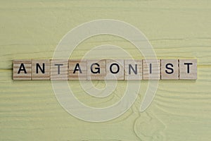 the word antagonist of gray small wooden letters