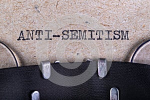 The word anti-semitism written in typewriter font. The inscription in the old style on gray paper